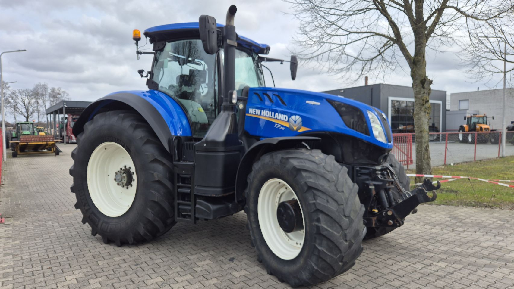New Holland T7.315 HD AC met Fronthef en Lucht