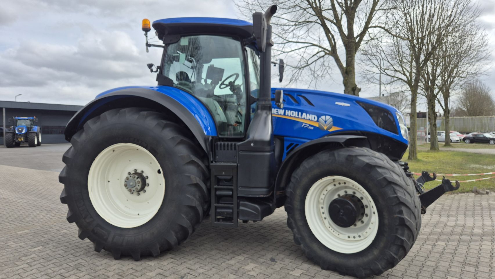 New Holland T7.315 HD AC met Fronthef en Lucht