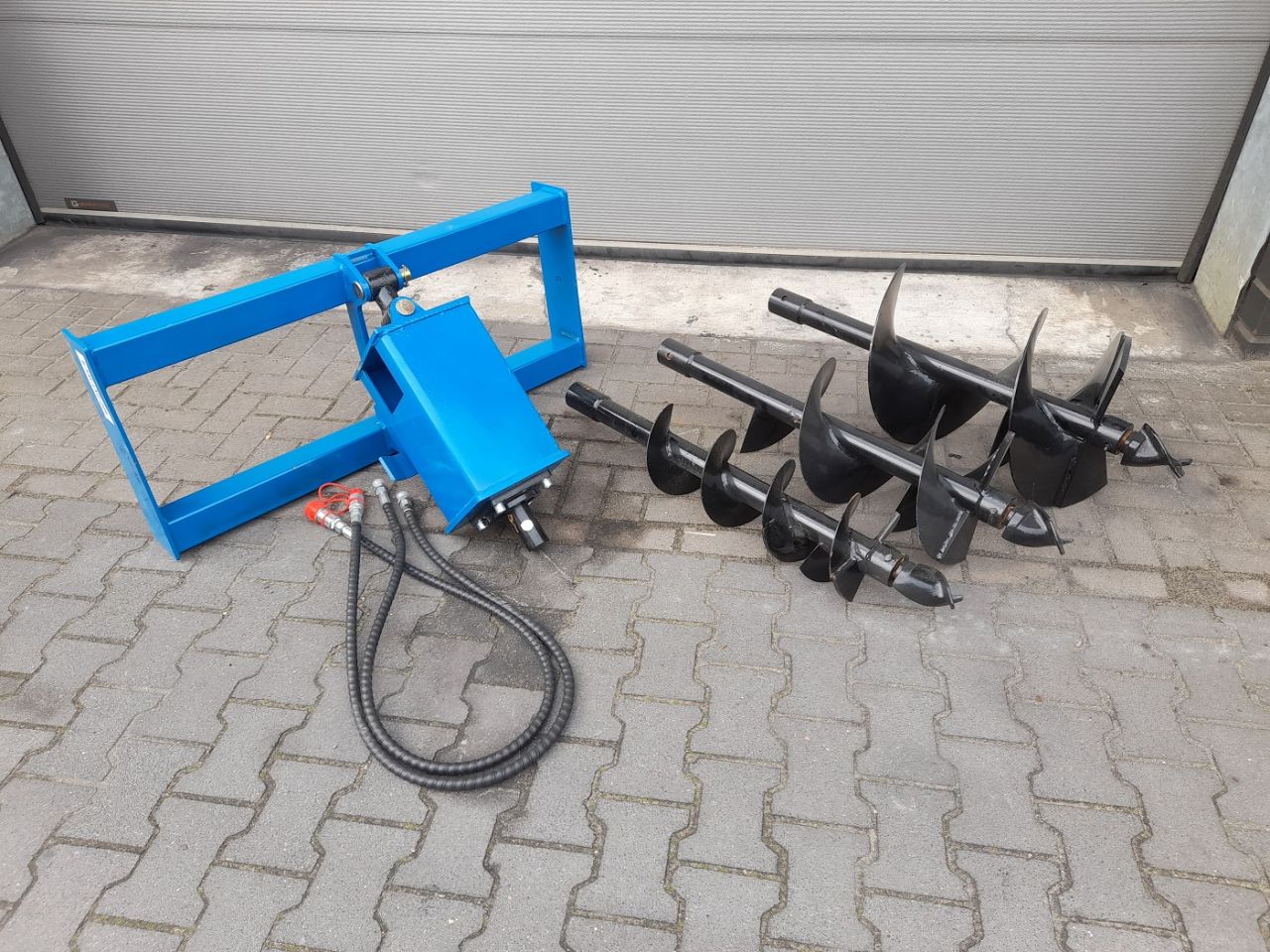 Hydraulische Grondboor Bobcat schranklader CAT Mustang Voorlader