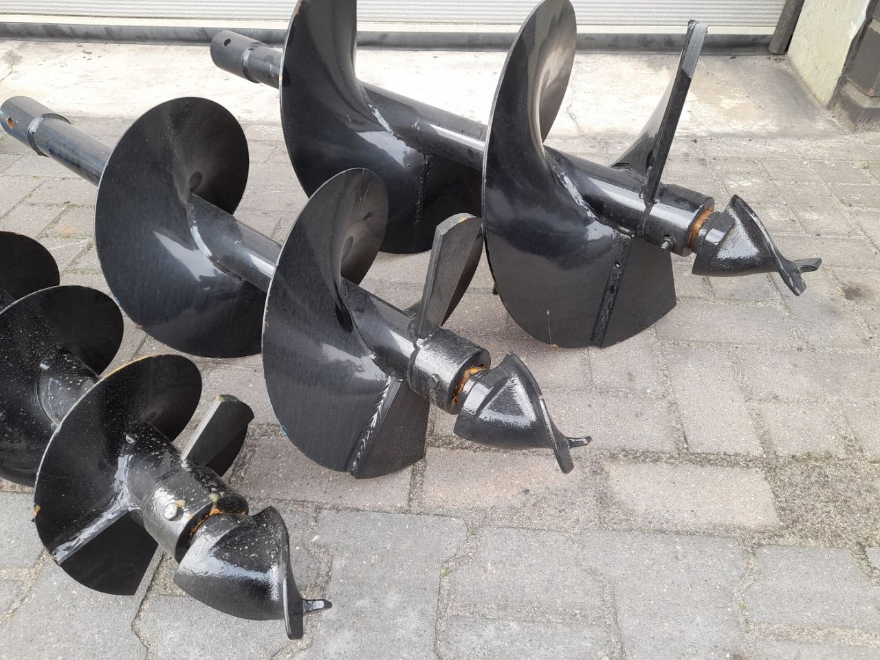 Hydraulische Grondboor Bobcat schranklader CAT Mustang Voorlader