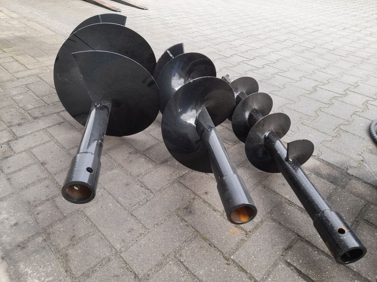 Hydraulische Grondboor Bobcat schranklader CAT Mustang Voorlader