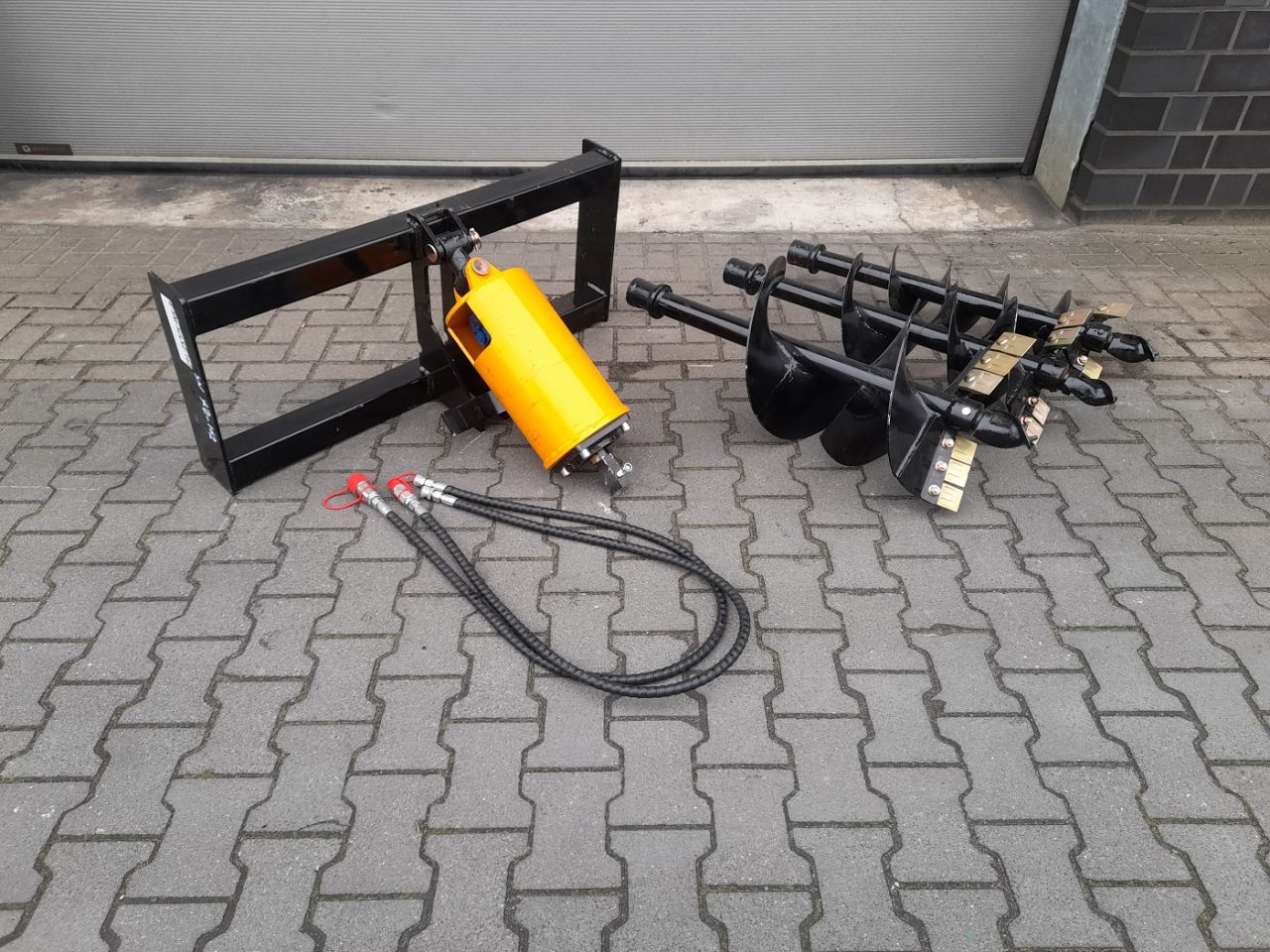 Hydraulische Grondboor Bobcat schranklader CAT Mustang Voorlader