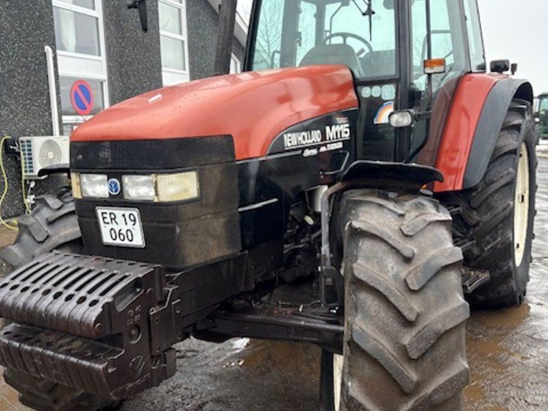 New Holland M115 EN EJERS, FRONTVÆGT, TVILLINGHJUL