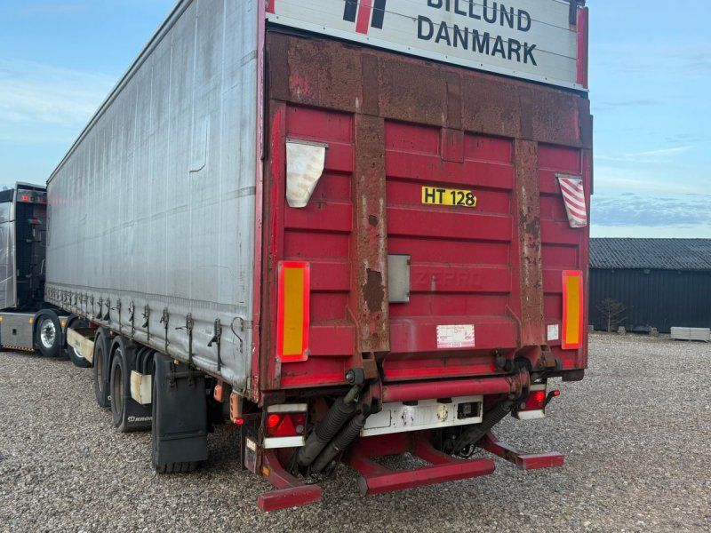 Krone 24 ton gardintrailer med læssebagsmæk 24T med læsserampe