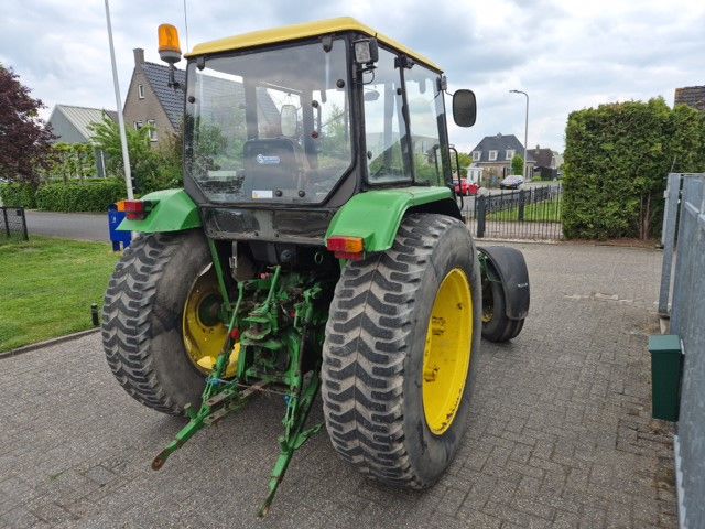 John Deere 1640 MC1 met fronthef.