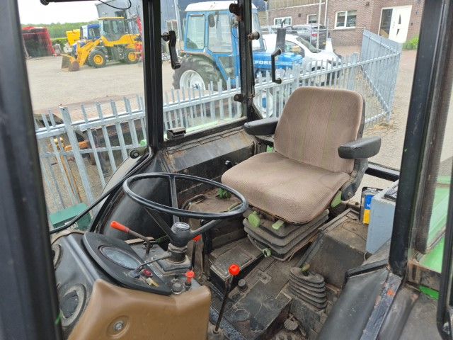 John Deere 1640 MC1 met fronthef.