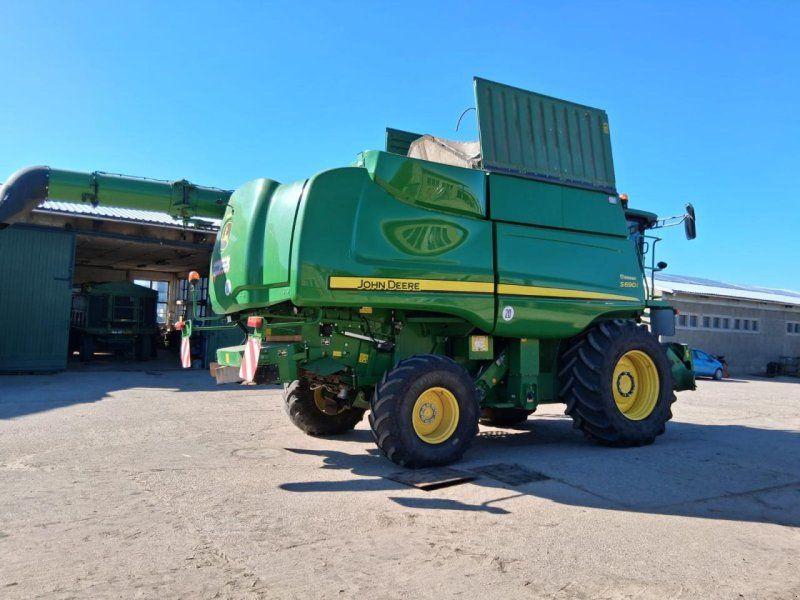 John Deere S 690i mit 2 Schneidwerken