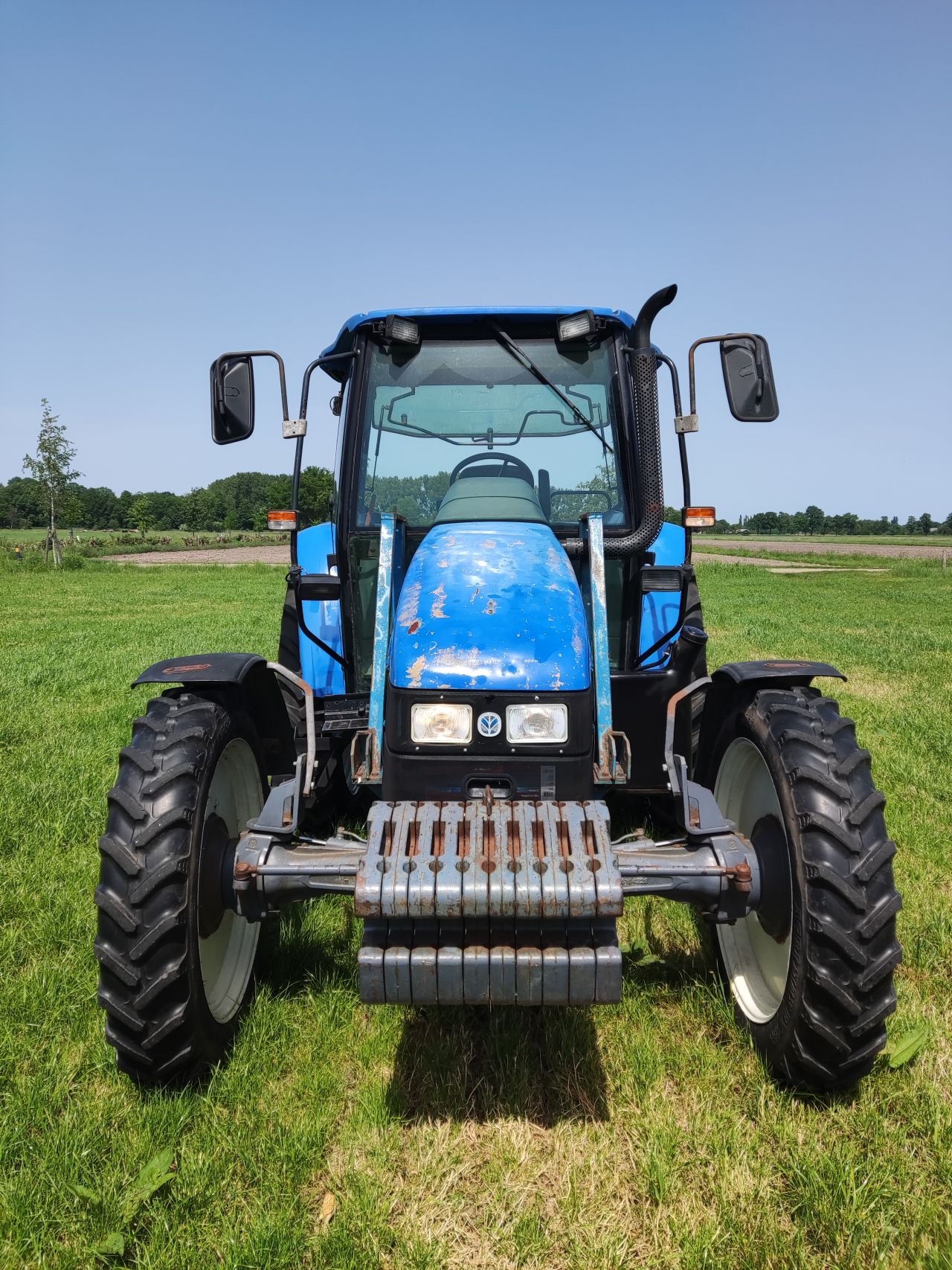 NEW HOLLAND tractor (type TL90, 90 pk, 5.768 uur, 4WD,)