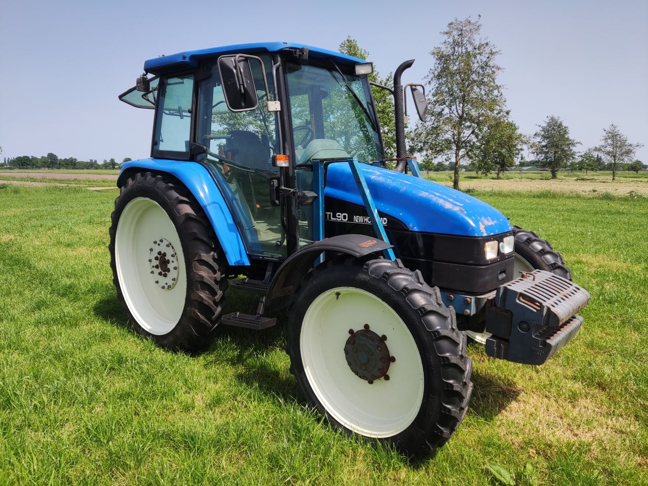 NEW HOLLAND tractor (type TL90, 90 pk, 5.768 uur, 4WD,)