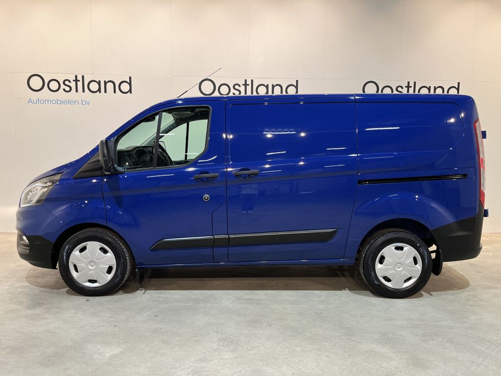 Ford Transit Custom 280 2.0 TDCI L1H1 Trend 130 PK Automaat / Euro 6 / Schuifdeur L + R / Airco / CarPlay / Cruise Control Adap. / Trekhaak / Navigatie / 3-Zits