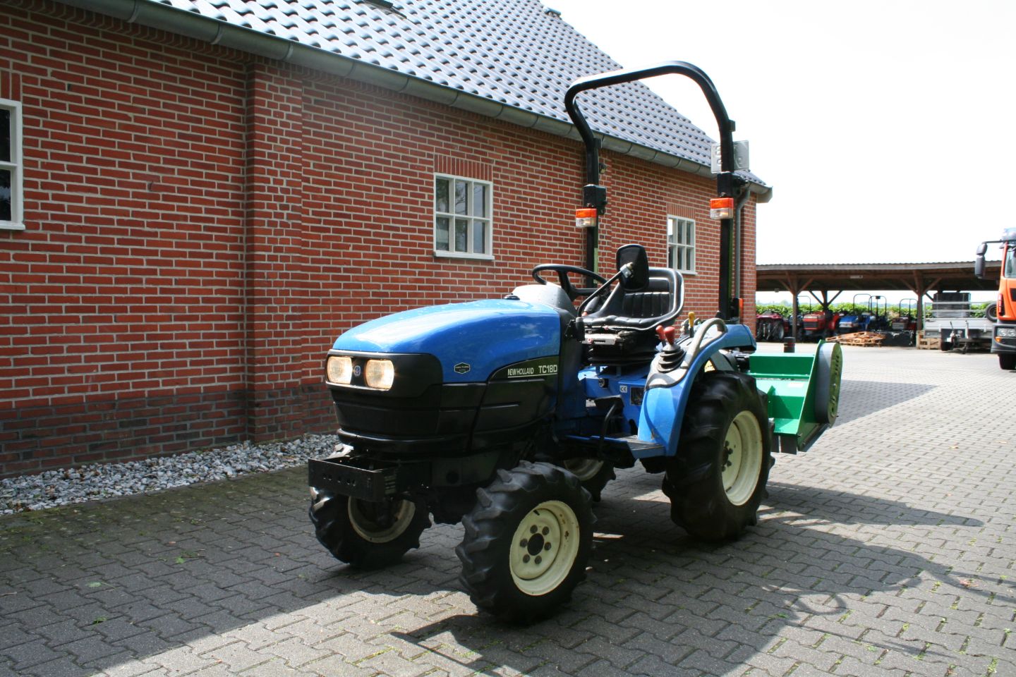 New Holland TC18D + flail mower 125 cm
