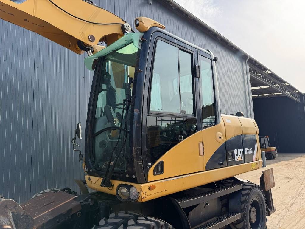 CAT M313D