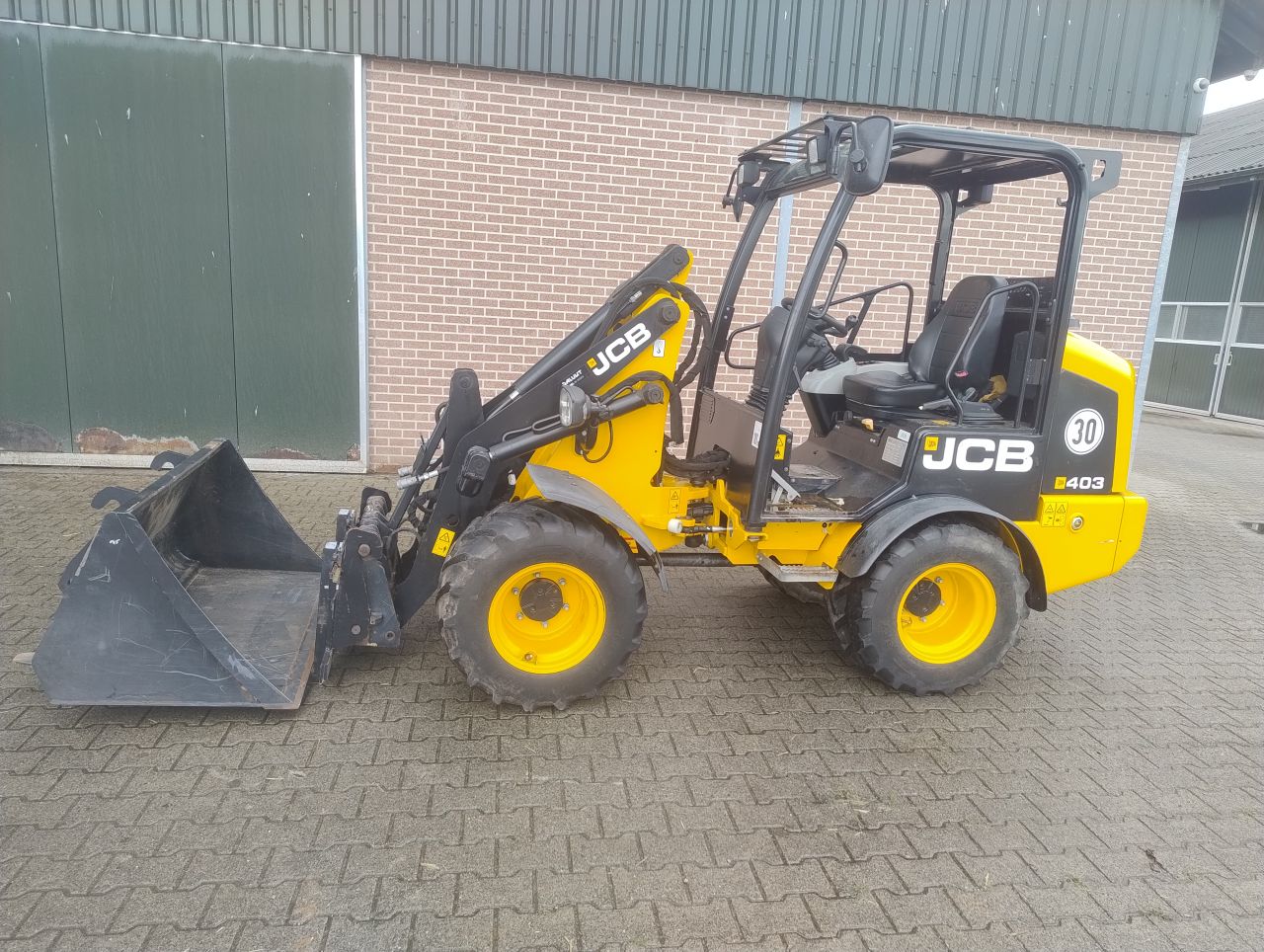 JCB 403 minishovel + bak en lepels