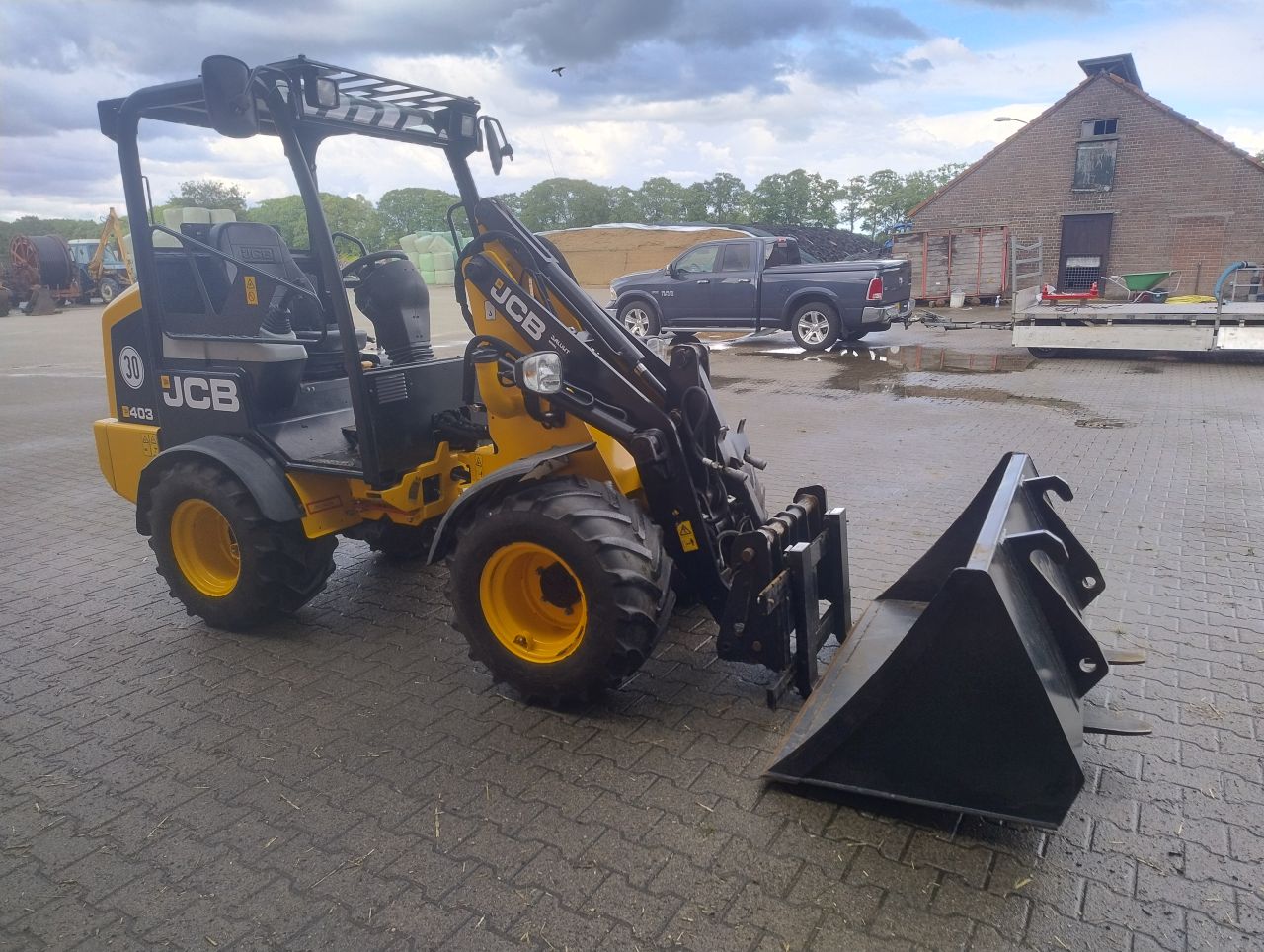 JCB 403 minishovel + bak en lepels