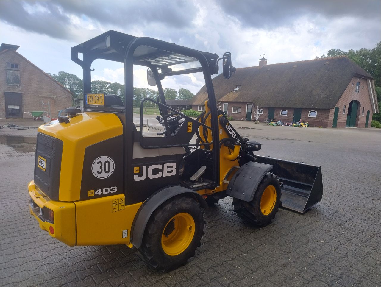 JCB 403 minishovel + bak en lepels