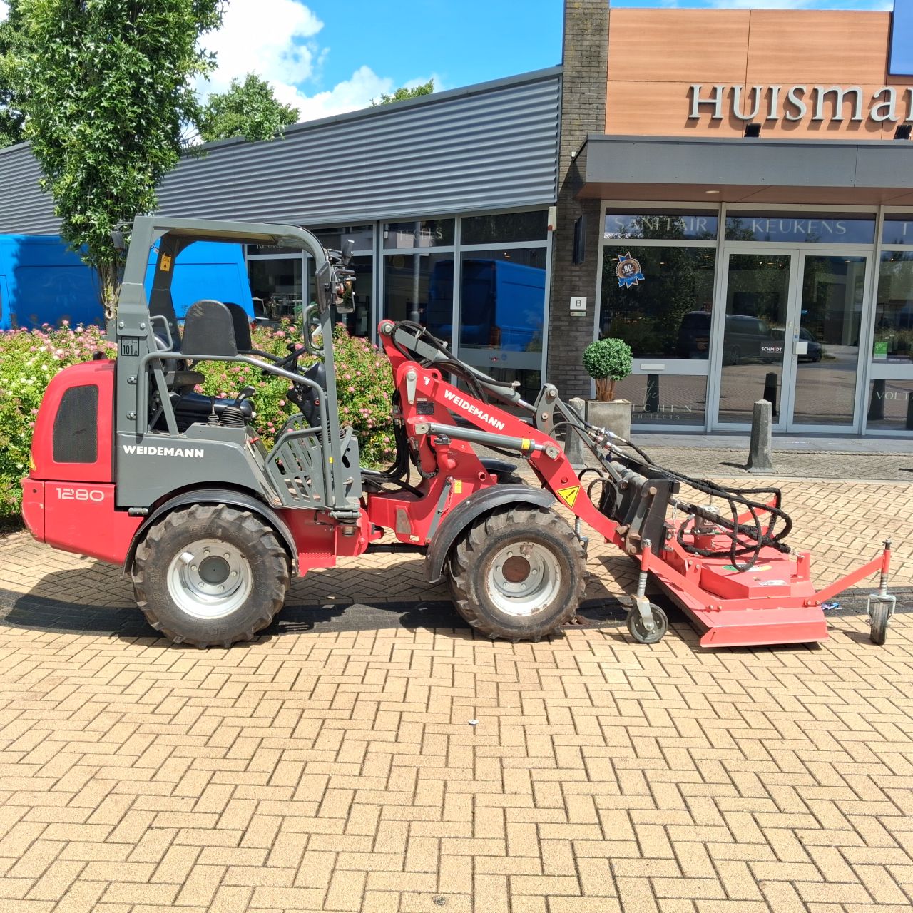 Weidemann 1280 Minishovel met Maaidek.