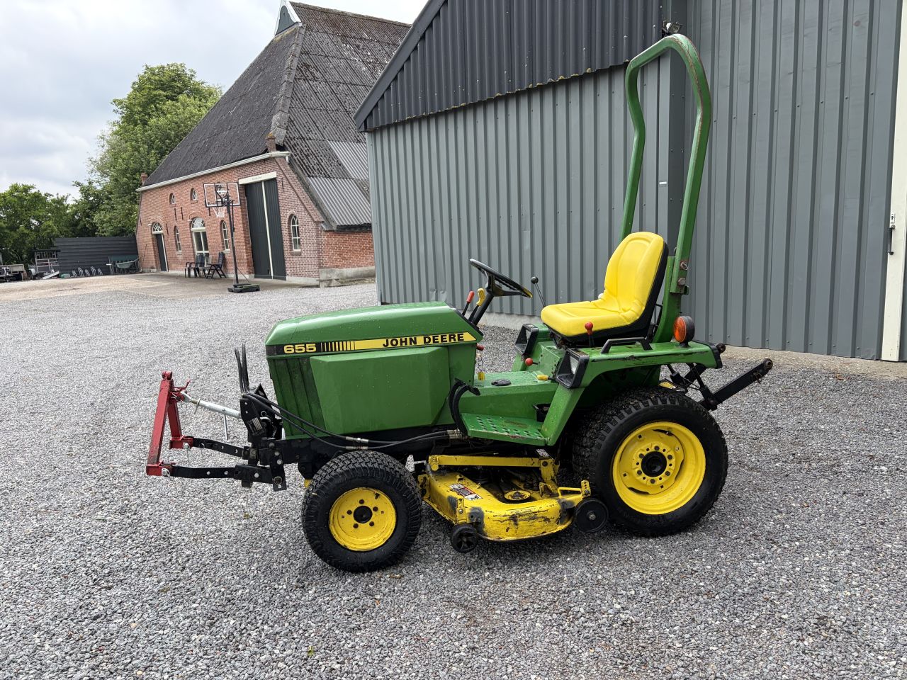 John Deere 655 compact tractor met maaidek
