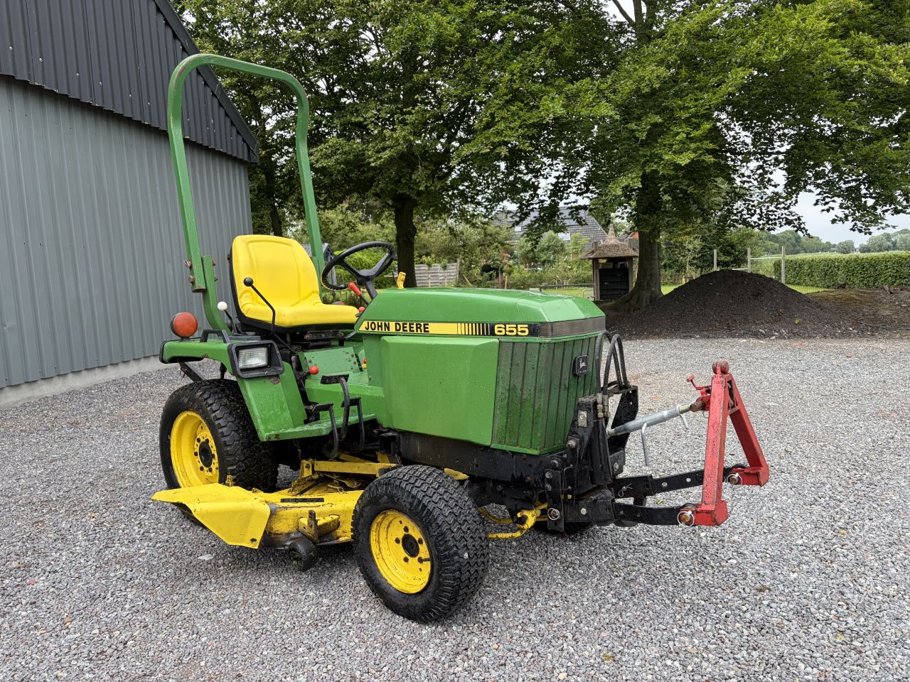 John Deere 655 compact tractor met maaidek