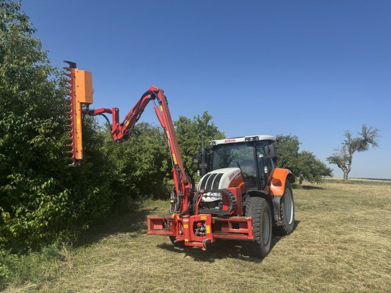 Steyr 4110 Profi Dücker UNA 500 Mulcher Astschere