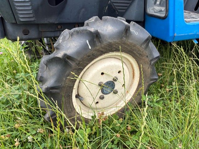 Iseki Landhope TU145F four-wheel-drive mini tractor with rotary tiller