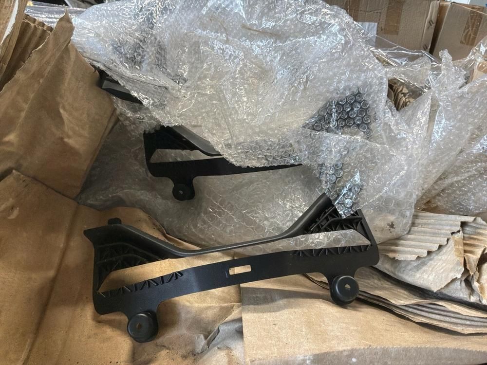 Super Soco Cux front windshield, wiring harnesses, brake pads and cables, hairnets, kickstands, controllers, chargers (18x)