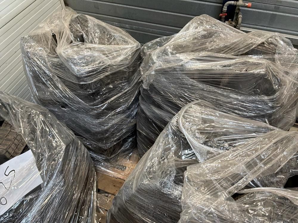 Super Soco Cux handlebars, spoilers, hand brakes, pallet of unused helmets, controllers (12x)