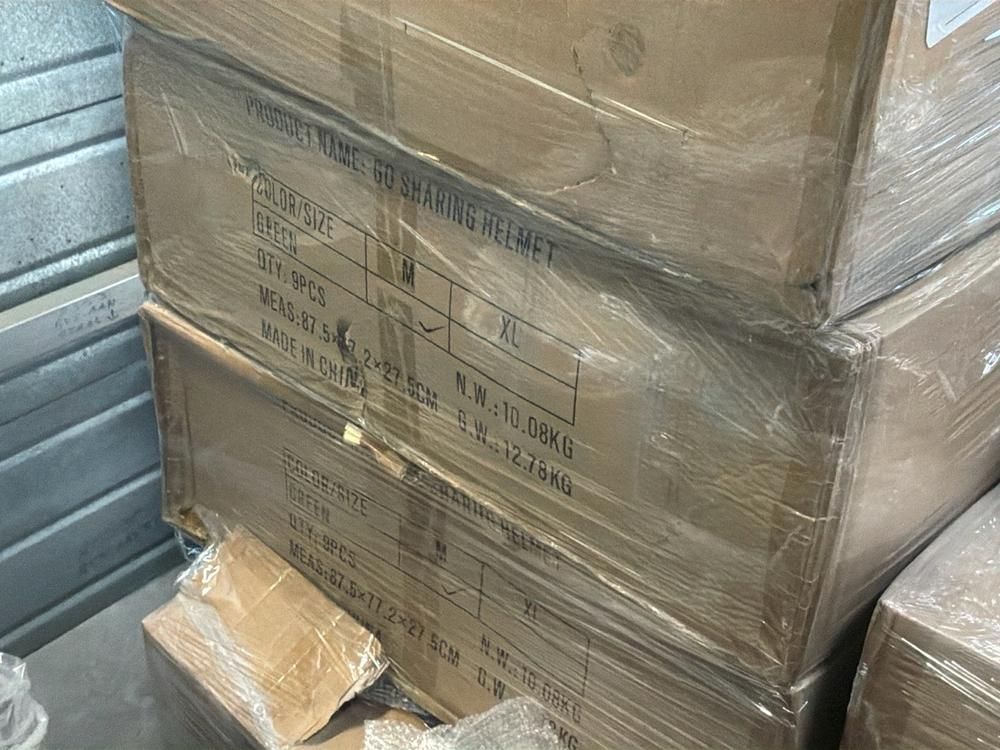 Super Soco Cux handlebars, spoilers, hand brakes, pallet of unused helmets, controllers (12x)