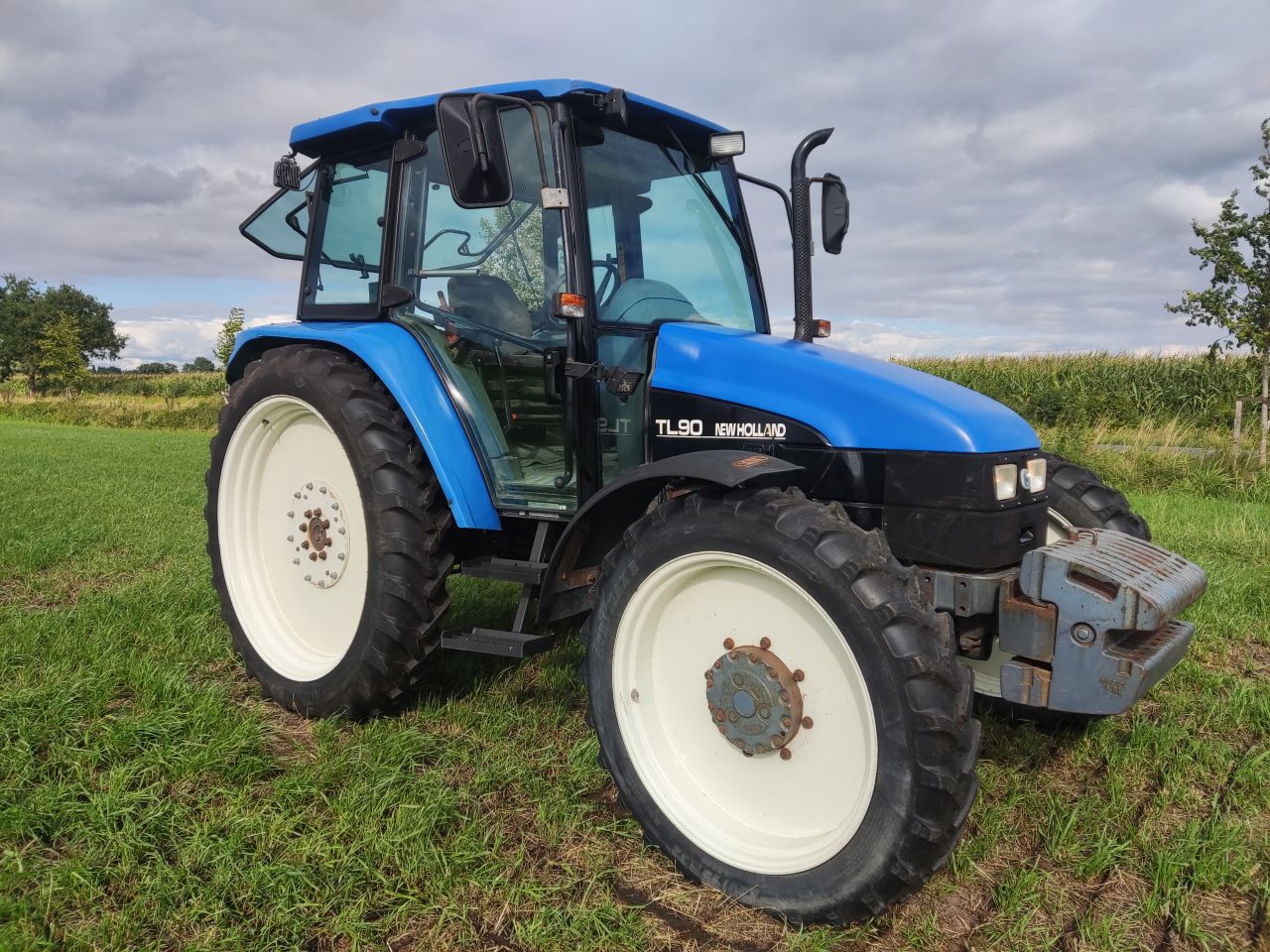 NEW HOLLAND tractor (type TL90, 90 pk, 5.768 uur, 4WD,)