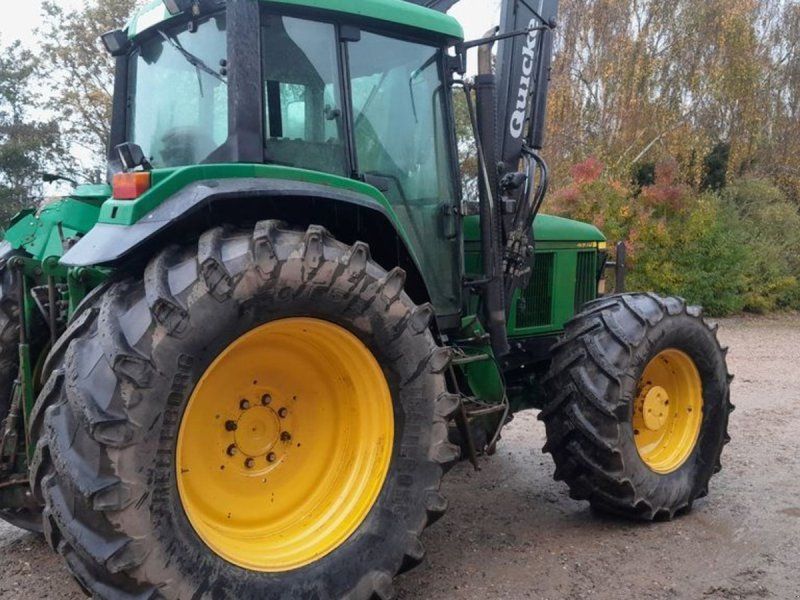 John Deere 6910 PowerQuad TLS med ÅLØ 980 frontlæsser og trykluftbremser