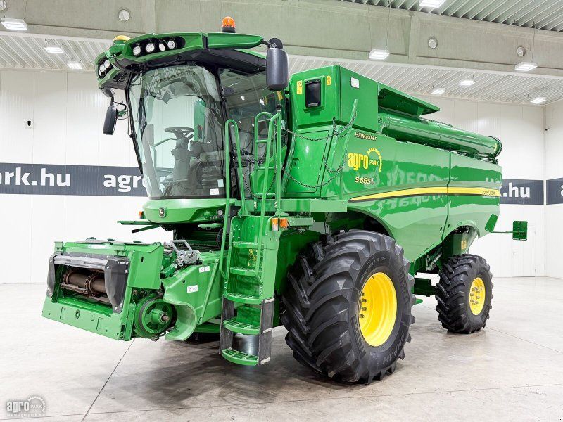 John Deere S685i Hillmaster rotary, 9,15 m 630R header, transport trailer,