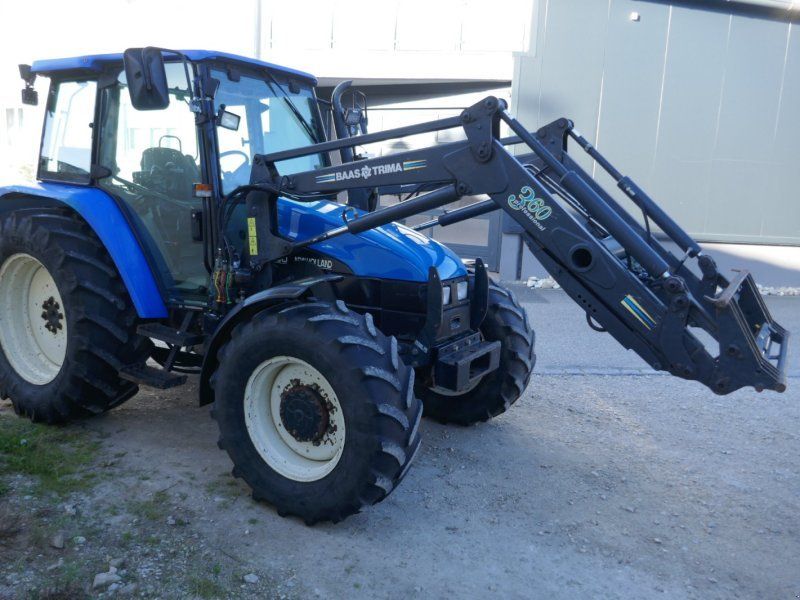 New Holland TL 100. Ind-Lader, Klima, Druckluft, Lastschaltung.  