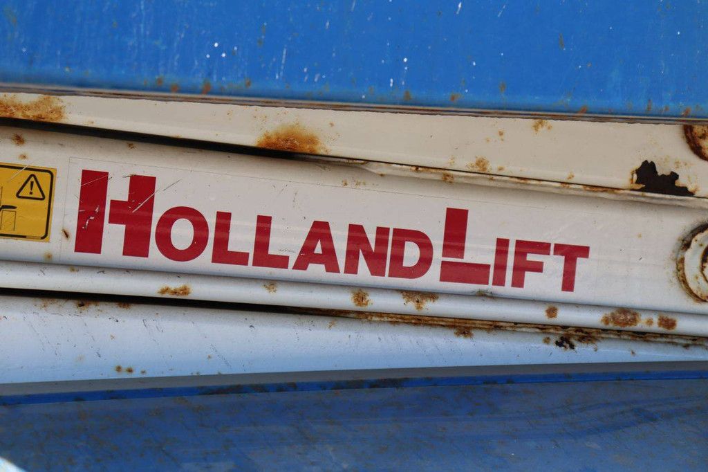 Scissor Lift Holland Lift Y-70DL12-TR Electric+Diesel 9m 2004