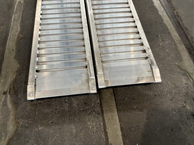 Aluminum ramps (unused) (2)