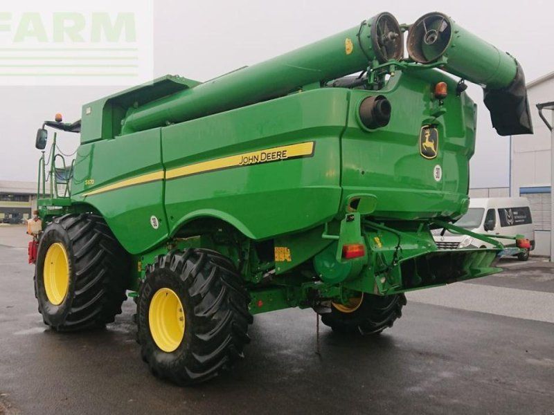 John Deere s670 4wd + macdon fd75