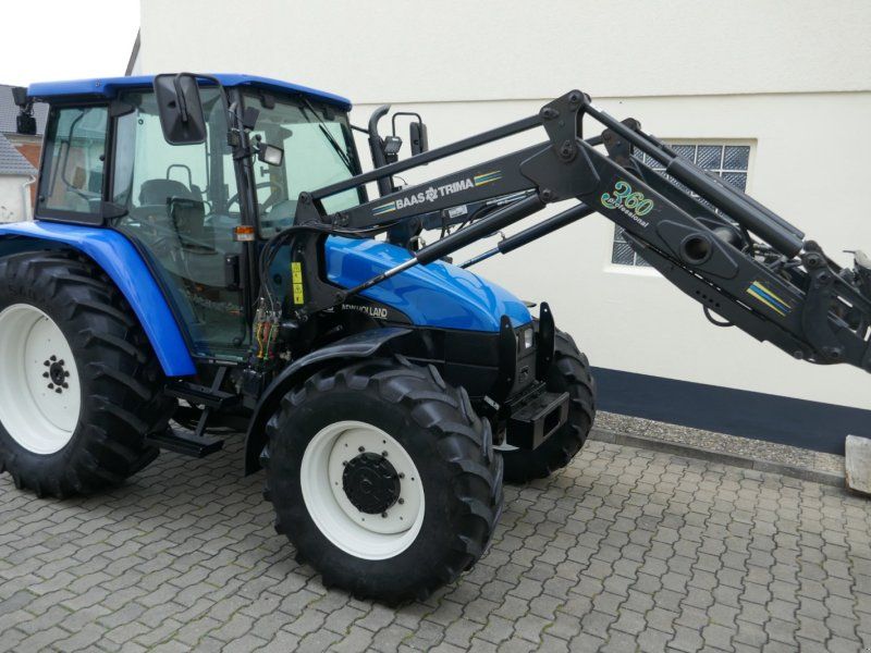 New Holland TL 100 Allr. Mit Druckluft, Klima, Ind-Lader. Sehr guter Zustand