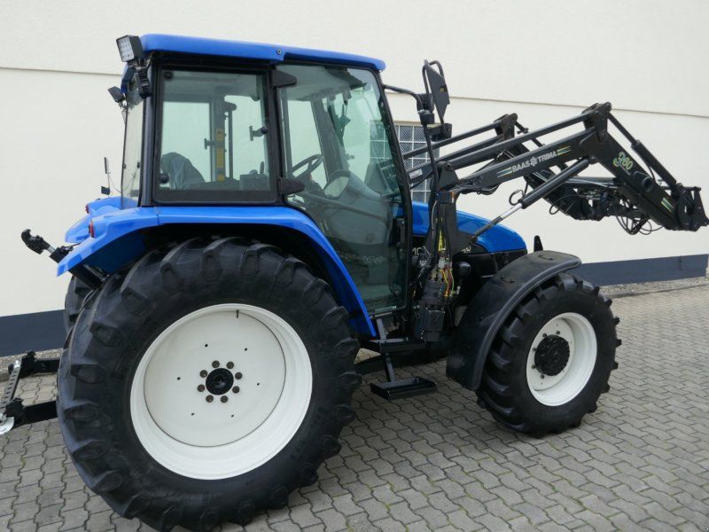 New Holland TL 100 Allr. Mit Druckluft, Klima, Ind-Lader. Sehr guter Zustand