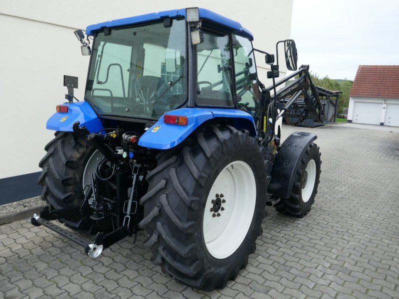 New Holland TL 100 Allr. Mit Druckluft, Klima, Ind-Lader. Sehr guter Zustand