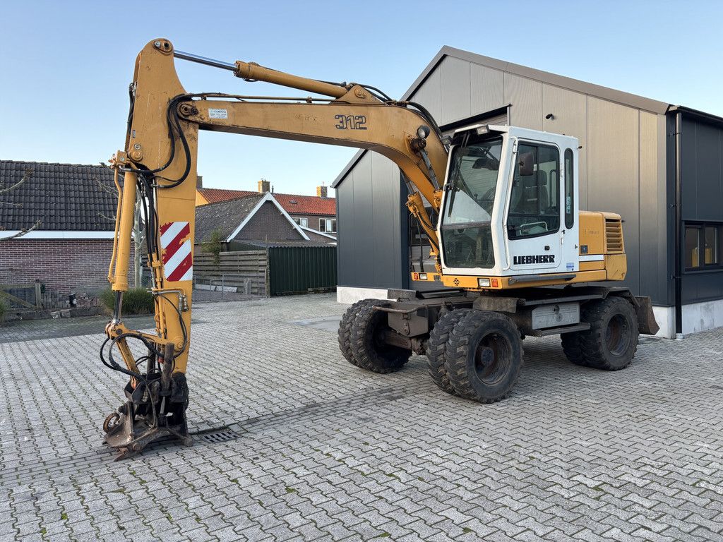 Liebherr A312 Hydr-Snelwissel, Kantelstuk.