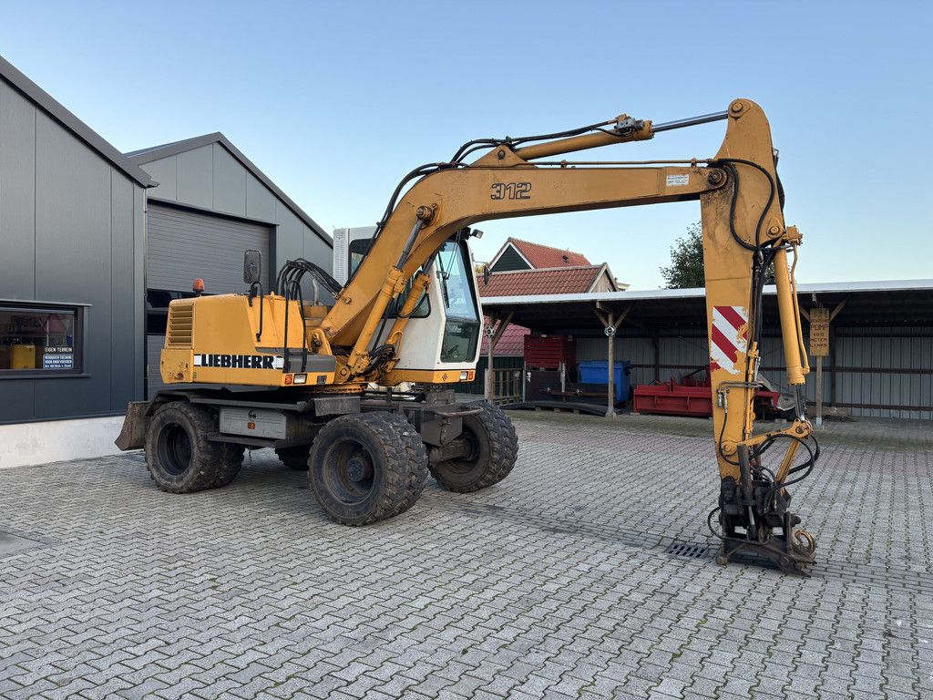 Liebherr A312 Hydr-Snelwissel, Kantelstuk.
