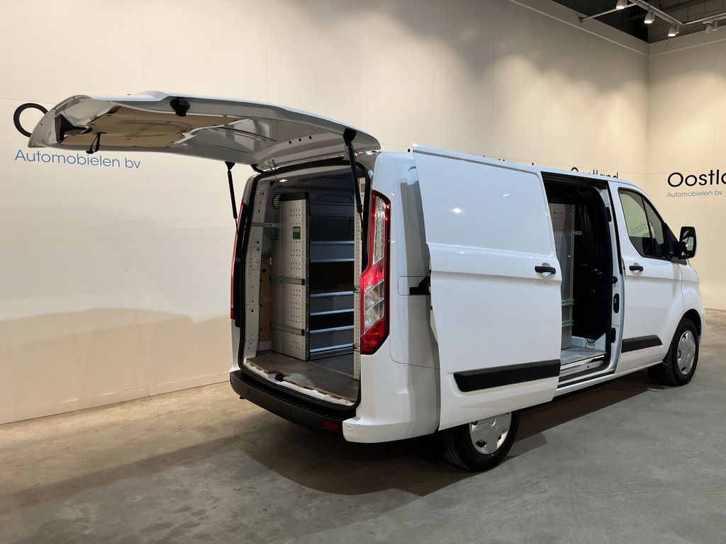 Ford Transit Custom 2.0 TDCI L1H1 Trend 130 PK / Servicebus / Bott Inrichting / Euro 6 / Schuifdeur L+R / Airco / CarPlay / Cruise Control / Camera / Navigatie / Klep / 3-Zits