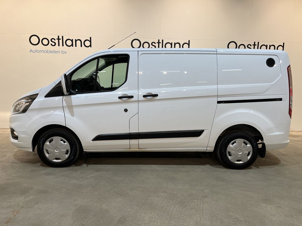 Ford Transit Custom 2.0 TDCI L1H1 Trend 130 PK / Servicebus / Bott Inrichting / Euro 6 / Schuifdeur L+R / Airco / CarPlay / Cruise Control / Camera / Navigatie / Klep / 3-Zits